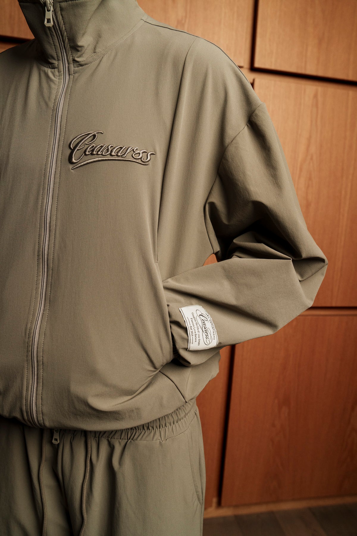 Man in CEASARSS Tracksuits