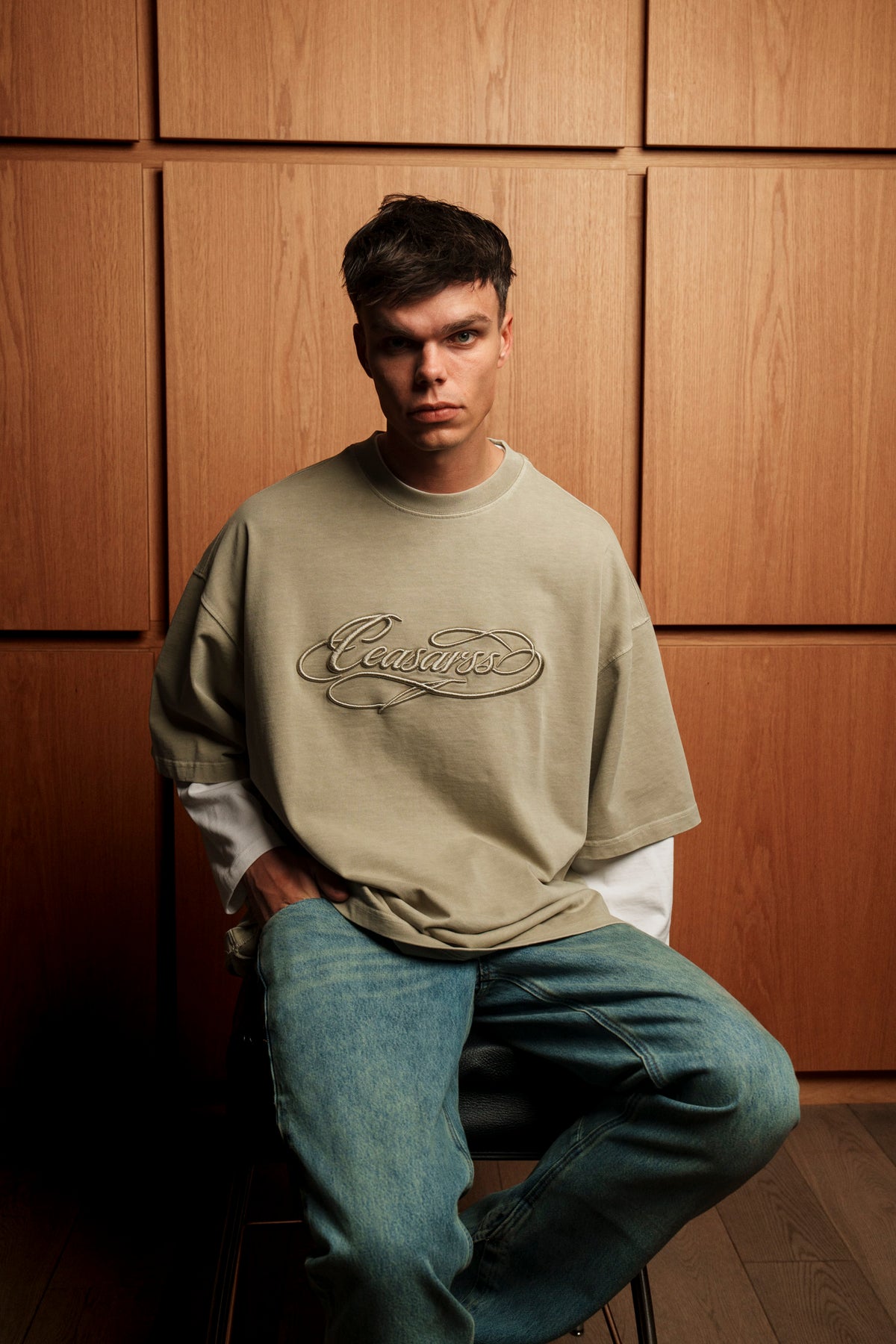 Man in CEASARSS Logo T-Shirt