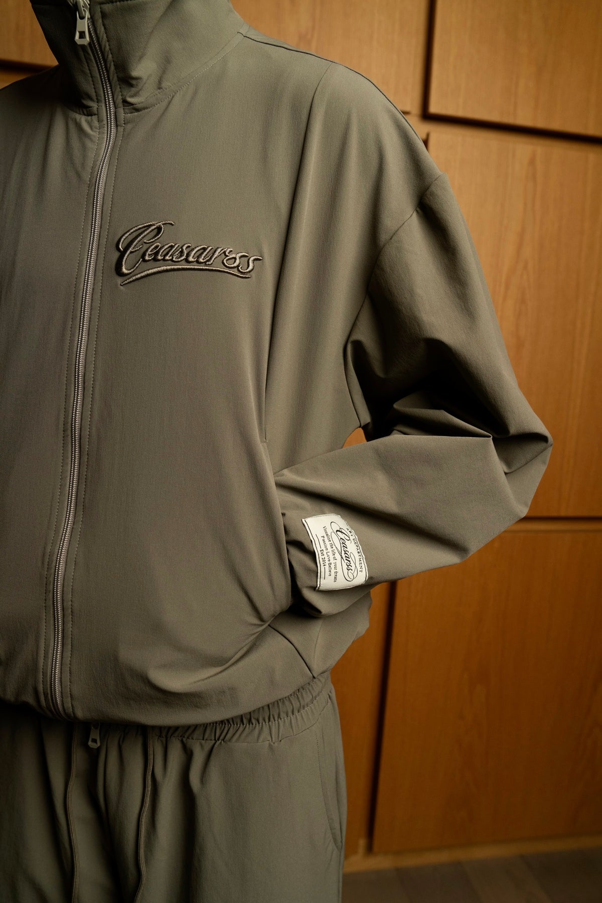 Man in CEASARSS Tracksuits